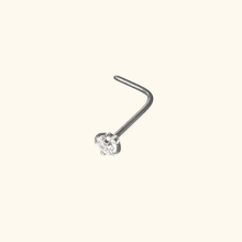 Load image into Gallery viewer, silver colored nose ring with a small clear gemstone on a beige background
