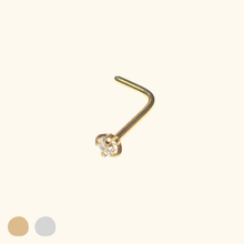 Load image into Gallery viewer, Gold nose ring with a small clear gemstone on a beige background
