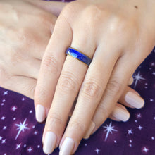 Load image into Gallery viewer, Hand wearing a blue ring with a starry background
