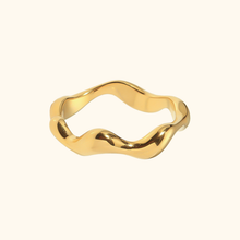 Load image into Gallery viewer, gold-colored wavy ring on a very light yellow background

