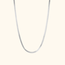 Load image into Gallery viewer, Silver herringbone necklace on a light beige background
