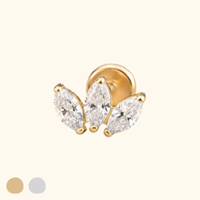Load image into Gallery viewer, Gold earring with three clear gemstones on a light yellow background
