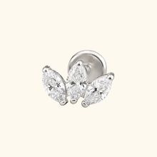 Load image into Gallery viewer, Silver earring with three clear gemstones on a light yellow background
