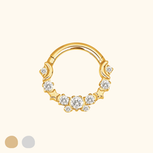 Load image into Gallery viewer, Gold nose ring with diamond-like stones on a light yellow background
